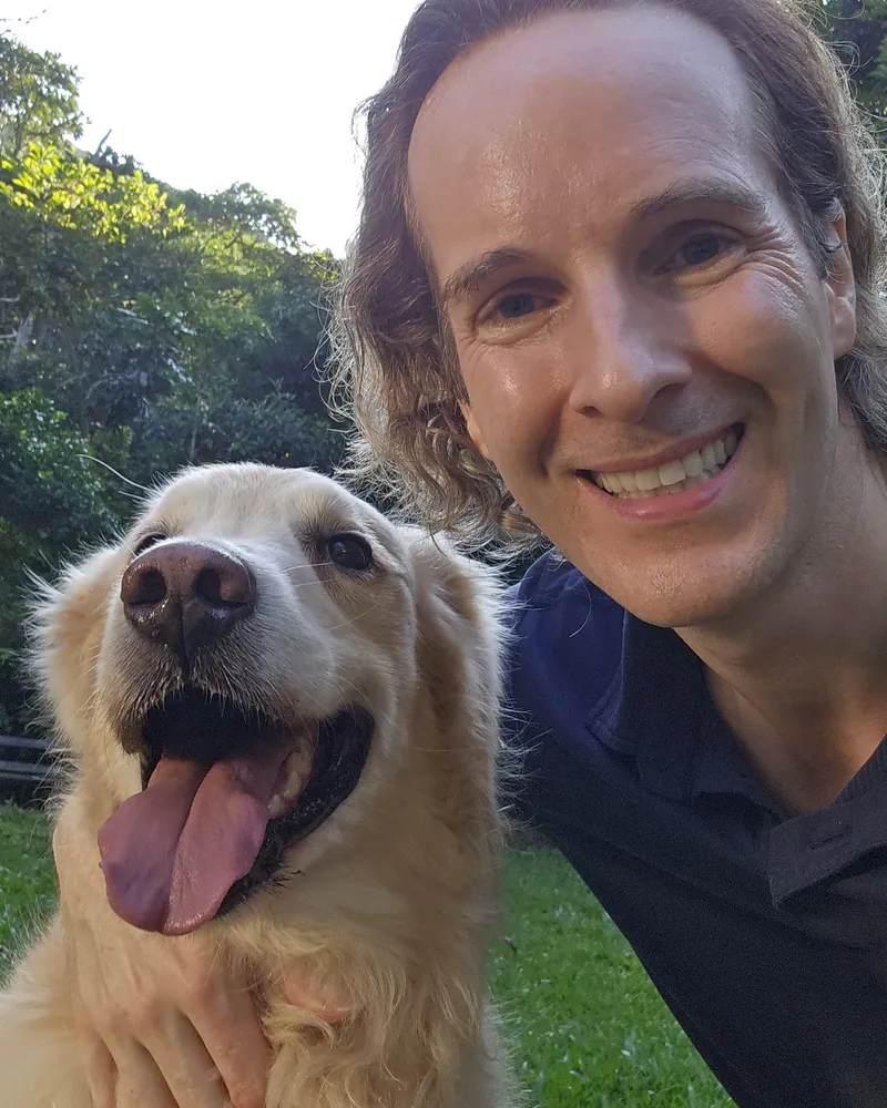 Felix Prehn, founder of Goat Academy and the Winston app, with his adopted golden retriever Winston
